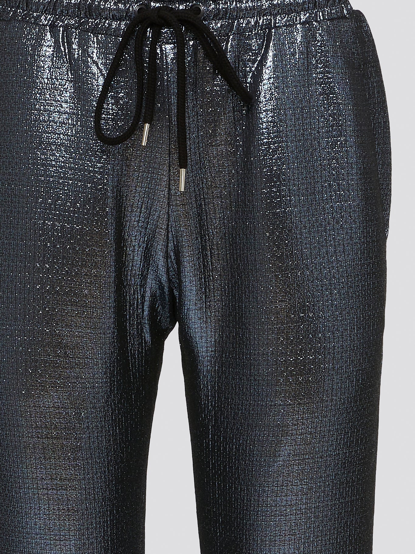 Feel your most chic and fashionable self in these stunning Blue Metallic Drawstring Pants by Markus Lupfer. The shimmering metallic finish will catch the light and turn heads wherever you go, making you the center of attention. With a comfortable drawstring waist and tapered fit, these pants are as effortless to wear as they are stylish.