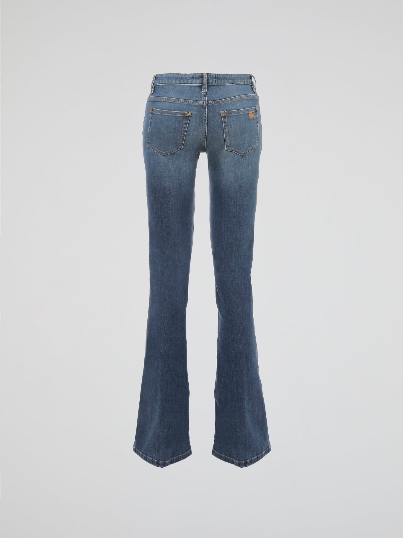 Step into a world of timeless elegance and contemporary finesse with Roberto Cavalli's Flared Denim Jeans. Crafted with meticulous attention to detail, these jeans effortlessly blend sophistication and comfort. From morning strolls to glamorous evenings, these flared denim jeans are your ultimate sartorial companion, making a bold statement wherever you go.