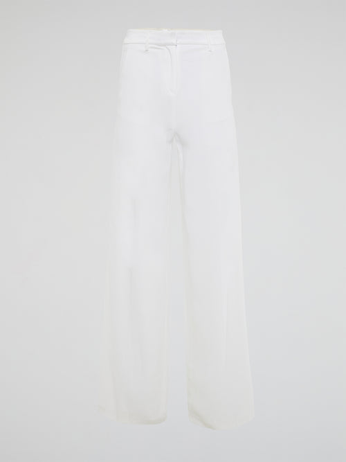 Elevate your style with these stunning white palazzo pants from Roberto Cavalli, designed to make you stand out from the crowd. The luxurious fabric drapes elegantly as you move, creating a sophisticated silhouette that is both comfortable and chic. Perfect for a day at the beach or a night on the town, these palazzo pants are a must-have addition to your wardrobe.