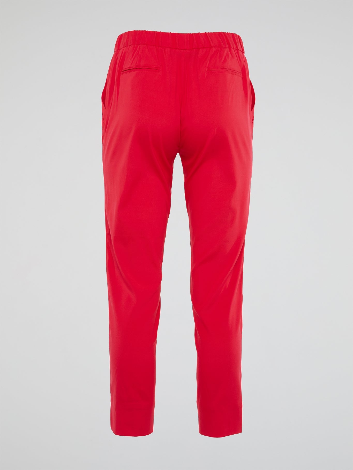 Unleash your inner wild side with the vibrant red hue of these Roberto Cavalli elasticated waist pants, designed to make a bold statement wherever you go. The luxurious fabric and impeccable tailoring ensure a flattering fit that's both comfortable and stylish, perfect for adding a touch of Italian glamour to your wardrobe. Elevate your everyday look with these eye-catching pants that exude confidence, sophistication, and a touch of playful eccentricity.