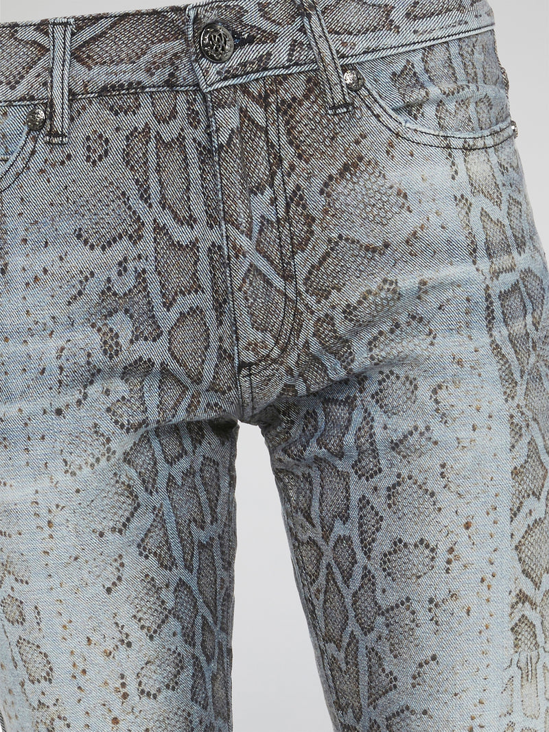 Unleash your wild side with the Roberto Cavalli Snake Print Denim Jeans, a bold and daring addition to your wardrobe that will turn heads wherever you go. Crafted from high-quality denim, these jeans feature a sleek snake print design that adds a touch of edgy sophistication to any outfit. Embrace your inner fashionista and elevate your style with these statement-making jeans that are sure to make you stand out from the crowd.