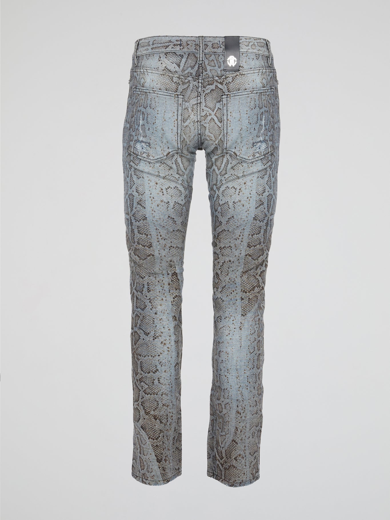 Unleash your wild side with the Roberto Cavalli Snake Print Denim Jeans, a bold and daring addition to your wardrobe that will turn heads wherever you go. Crafted from high-quality denim, these jeans feature a sleek snake print design that adds a touch of edgy sophistication to any outfit. Embrace your inner fashionista and elevate your style with these statement-making jeans that are sure to make you stand out from the crowd.