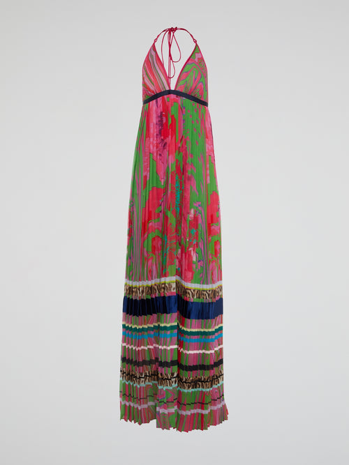 Feel like a bohemian goddess in this stunning halter neck accordion maxi dress by Roberto Cavalli. The flowing fabric drapes beautifully, while the halter neck adds a touch of sophistication to the look. Perfect for a summer wedding or a night out on the town, this dress will make you feel effortlessly chic and stylish.