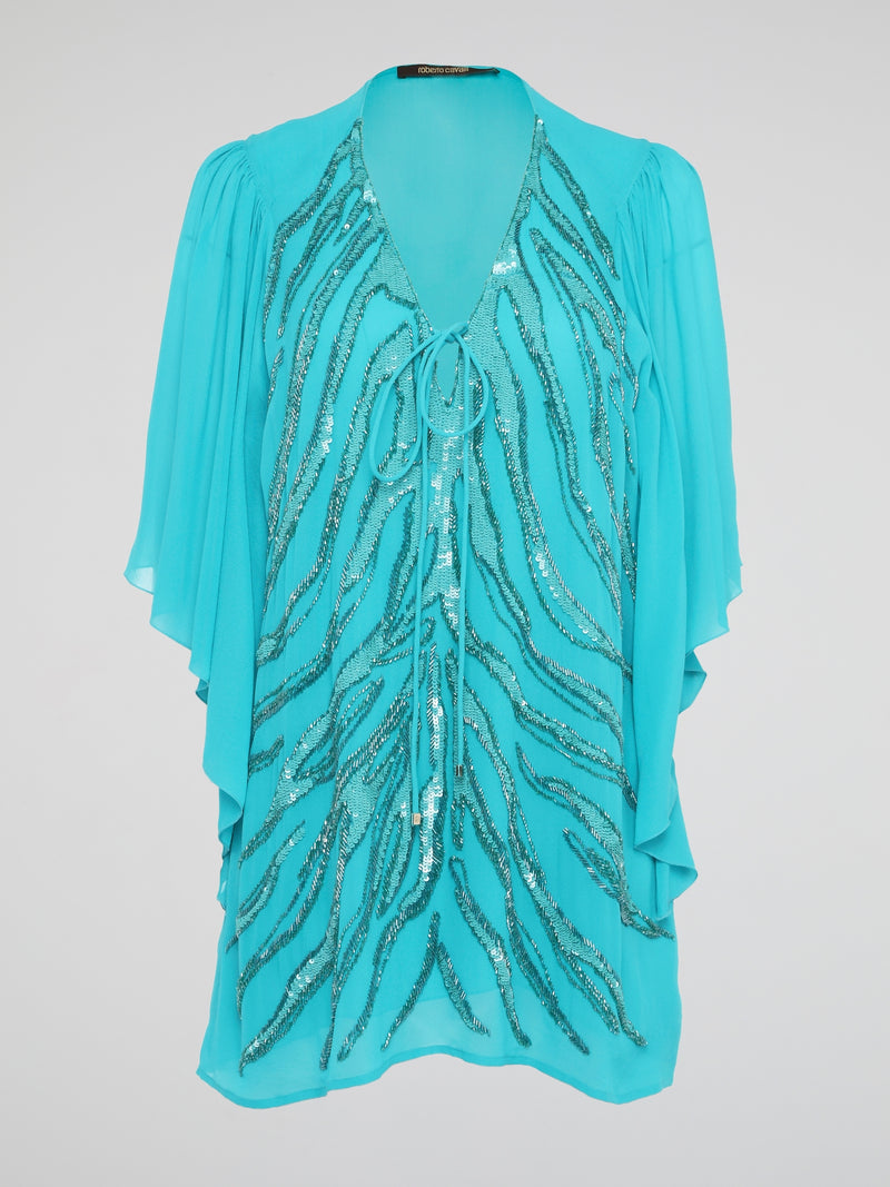 Shine like a star in the mesmerizing Blue Sequin Detailed Kaftan by Roberto Cavalli. This stunning piece features intricate sequin embellishments that capture the light and glimmer with every move you make. Perfect for a beach getaway or a special occasion, this kaftan exudes luxury and glamour, ensuring all eyes are on you wherever you go.