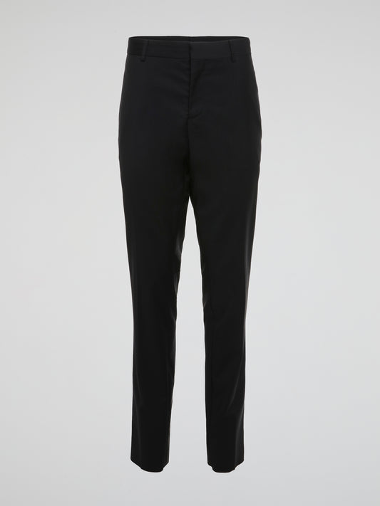 Elevate your wardrobe with these sleek and sophisticated Black High Waist Suit Pants by Roberto Cavalli. Crafted with meticulous attention to detail, these pants feature a flattering high waist design that elongates your silhouette. Whether styled with a crisp white shirt for the office or a statement blouse for a night out, these pants are sure to turn heads wherever you go.