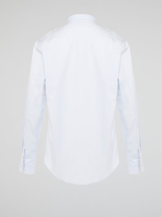 Elevate your wardrobe with the effortlessly chic White Long Sleeve Shirt by Roberto Cavalli. Crafted from luxurious fabric with impeccable attention to detail, this versatile piece exudes sophistication and glamour. Embrace a timeless look that seamlessly transitions from day to night with this must-have staple.