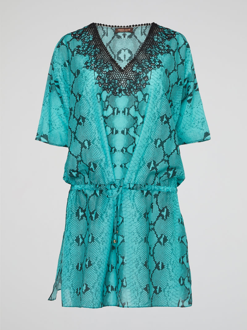 Embrace your wild side with the luxurious Green Snake Print Kaftan by Roberto Cavalli. This stunning piece will make you feel like a tropical goddess, with its flowing silhouette and eye-catching snake print design. Perfect for lounging by the pool or making a statement at a beach party, this kaftan is sure to turn heads wherever you go.