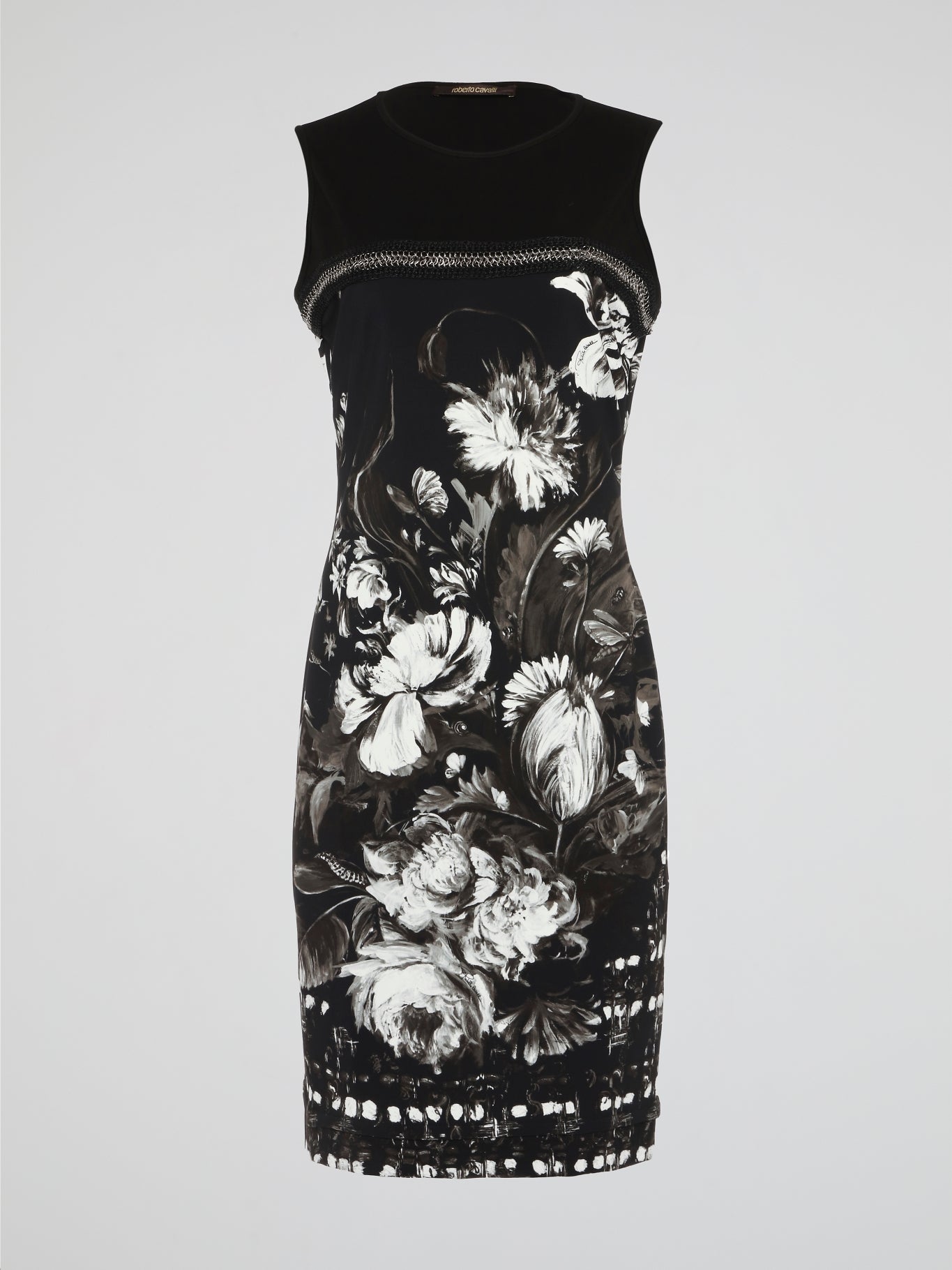 Transport yourself to a blooming garden with our Floral Print Bodycon Dress by Roberto Cavalli. This mesmerizing masterpiece intertwines vibrant petals and delicate stems, creating a whimsical harmony of colors and patterns. Crafted with the utmost precision, this body-hugging dress will not only flatter your figure but also ignite a sense of enchantment wherever you go.