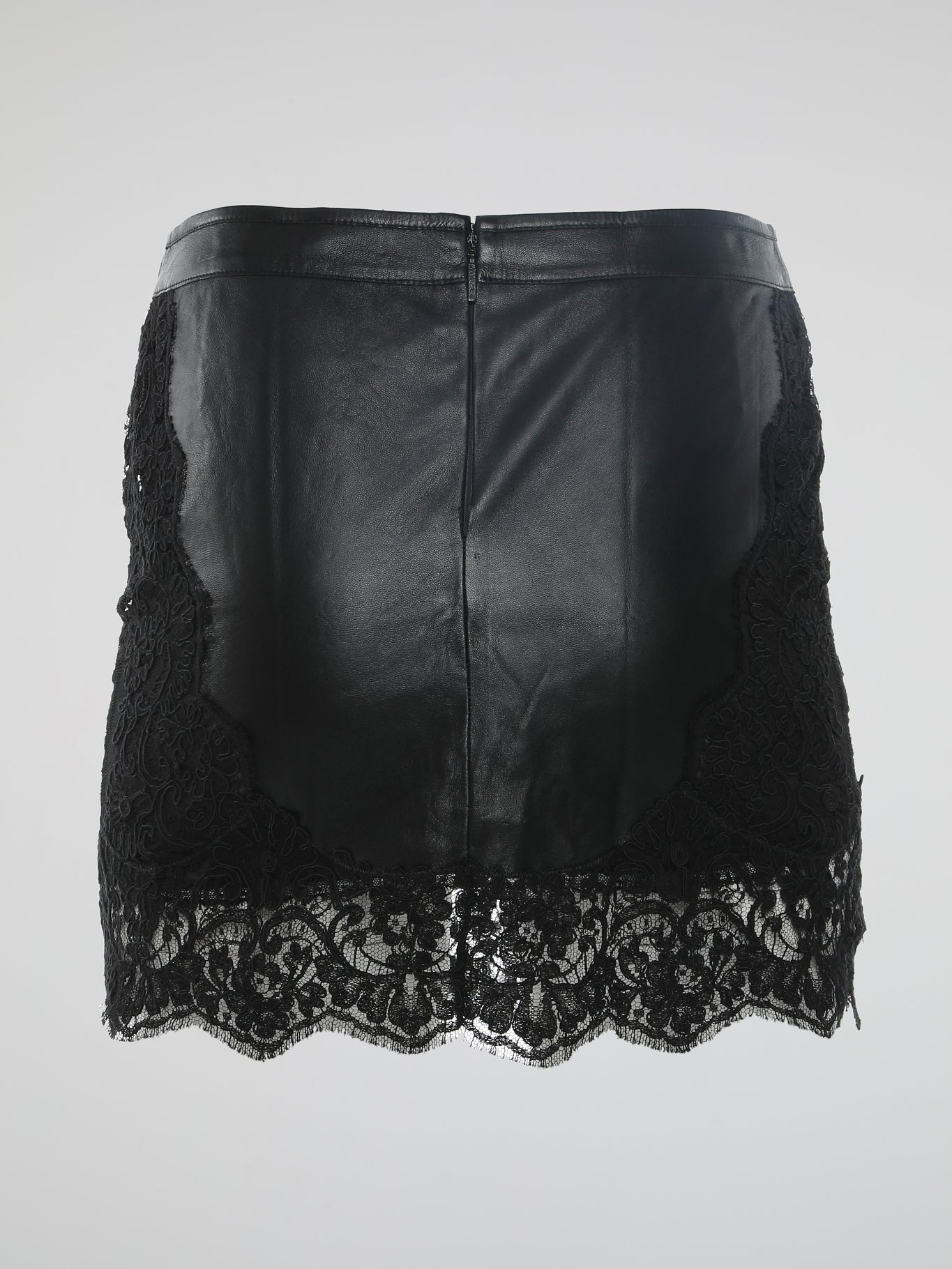 Update your wardrobe with a touch of elegance and edge with the Lace Hem Leather Skirt by Roberto Cavalli. This versatile piece effortlessly combines the luxury of leather with the delicate beauty of lace, showcasing the designer's impeccable attention to detail. Whether paired with ankle boots for a daytime look or with stilettos for a glamorous evening affair, this skirt exudes confidence and sophistication.