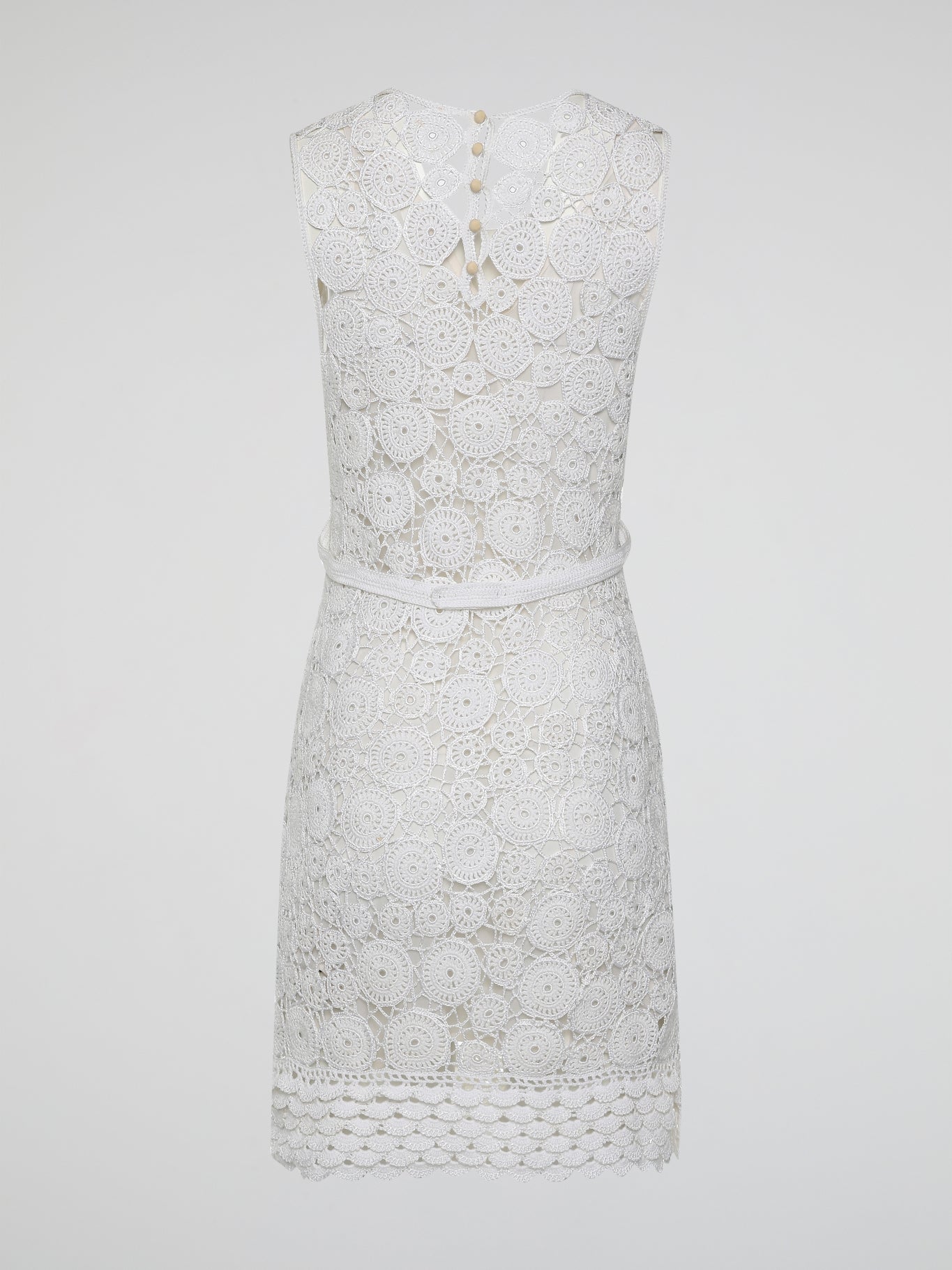 Step into the world of exquisite elegance with this captivating White Crochet Dress by Roberto Cavalli. Crafted with meticulous attention to detail, this dress channels the essence of femininity, showcasing delicate crochet patterns that gracefully embrace your silhouette. Whether you're attending a garden soiree or a beachfront dinner, this dress effortlessly combines timeless charm with modern flair, making you the epitome of effortless beauty.