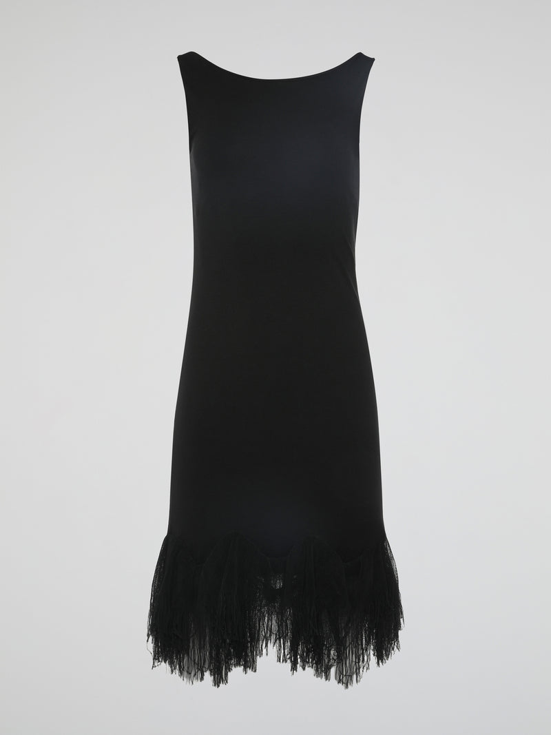 Introducing the epitome of elegance and glamour – the Black Fringe Hem Dress by Roberto Cavalli. This show-stopping piece combines the timeless sophistication of a little black dress with the playful flair of fringed details. With its figure-hugging silhouette and exquisite craftsmanship, this dress is a must-have for those seeking to make a lasting impression at any occasion.