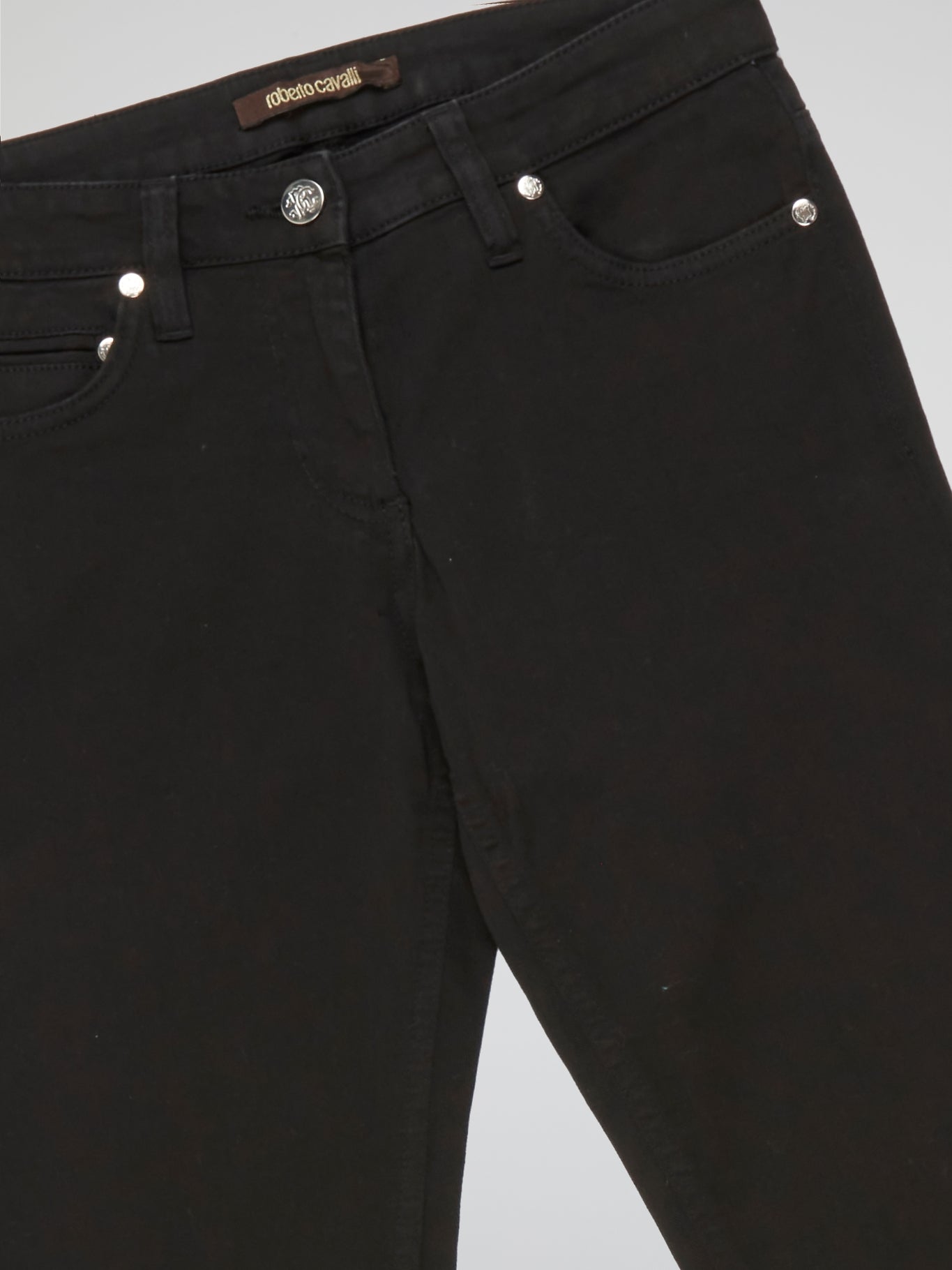 Step into style and unlock a world of sophistication with our Black Straight Fit Jeans by Roberto Cavalli. Crafted from premium quality denim, these jeans seamlessly blend comfort and durability. From casual outings to elegant evening affairs, these jeans effortlessly elevate your fashion game with their sleek, contemporary design.