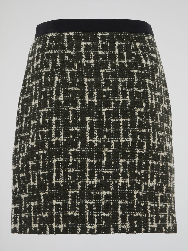 Step into the world of elegance and sophistication with the Tweed Mini Skirt by Emanuel Ungaro. Crafted with the utmost care, this skirt effortlessly fuses timeless style with a contemporary edge. From office meetings to evening soirees, embrace your inner fashionista and make a statement wherever you go with this iconic piece.