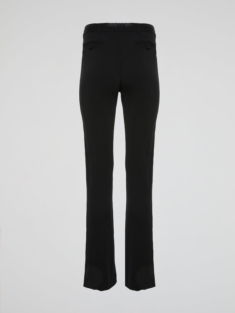 Step up your fashion game with these black high-waist flared pants by Roberto Cavalli. Crafted with impeccable craftsmanship and a touch of glamour, these pants exude elegance and style. Whether you are hitting the dance floor or a fancy dinner party, these pants will effortlessly flatter your figure and make heads turn.