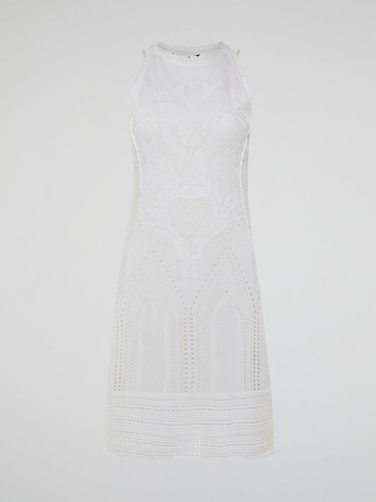 Dance into shimmering moonlit nights in the ethereal beauty of the White Knitted Sleeveless Dress by Roberto Cavalli. Crafted with meticulous artistry, this exquisite dress features delicate knitted patterns that seamlessly cascade down your curves, creating an enchanting silhouette. With its timeless elegance and romantic charm, this dress is a masterpiece that exudes pure grace and allure.