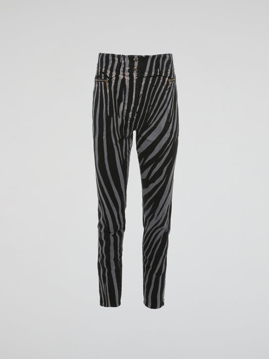 Unleash your wild side with these Zebra Print High Waist Trousers by Roberto Cavalli. Crafted with impeccable precision, these trousers effortlessly blend elegance with an untamed touch. Perfect for those who dare to stand out, channel your inner fashionista and let the world be your runway in these fierce and fabulous statement trousers.
