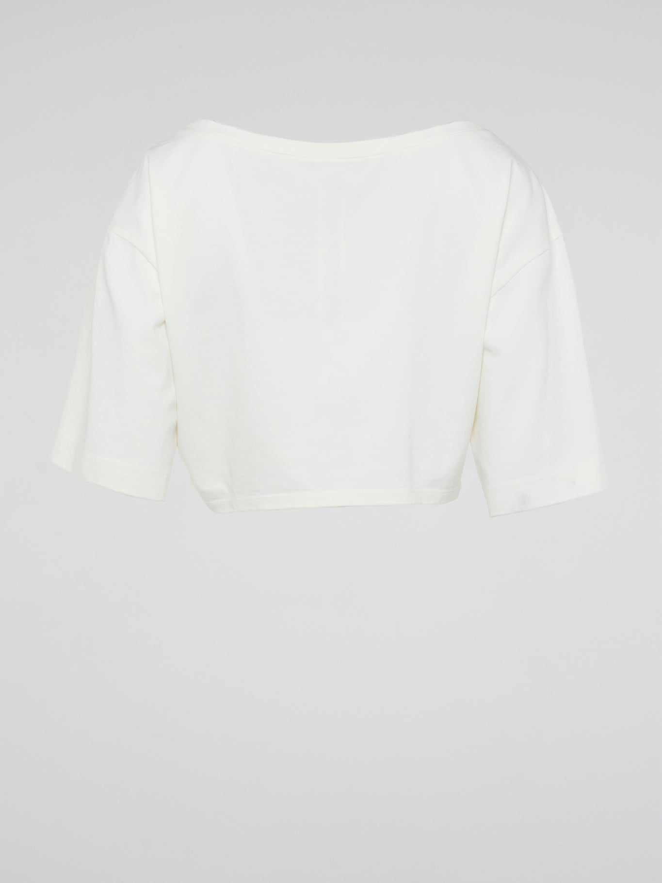 Introducing the White Crop Top by Roberto Cavalli, where elegance meets modern femininity. Crafted with luxurious fabrics and meticulous attention to detail, this wardrobe staple exudes effortless sophistication. From casual brunches to glamorous evenings, this versatile piece is guaranteed to turn heads and make a bold fashion statement.