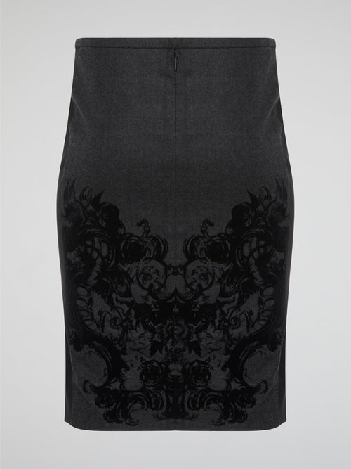 Elevate your office attire with this stunning grey printed pencil skirt from iconic designer Roberto Cavalli. The intricate pattern adds a touch of sophistication and style, making you stand out from the crowd. Pair it with a crisp white blouse and heels for a polished and fashion-forward look that will turn heads wherever you go.