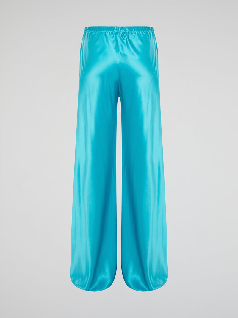 Step up your style game with these luxurious blue silk pants by Roberto Cavalli. The drawstring waist adds a casual and comfortable touch to the elegant silk fabric, making them perfect for any occasion. Stand out from the crowd and make a statement with these unique and eye-catching pants.