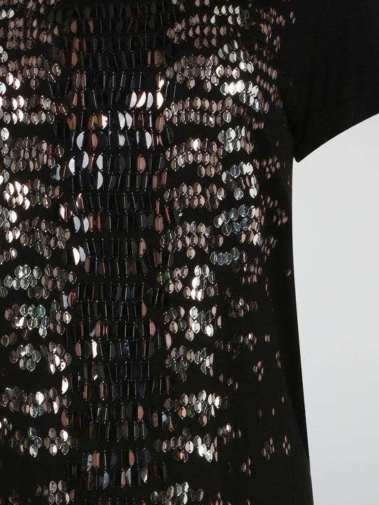 Shimmer and shine in style with the Black Sequin Embroidered T-Shirt Dress from Roberto Cavalli. This versatile piece effortlessly combines casual comfort with high-fashion glamour, making it perfect for any occasion. Stand out from the crowd and turn heads wherever you go in this show-stopping must-have.