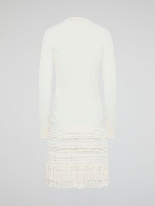 Elevate your winter wardrobe with the luxurious White Knitted Sweater Dress by Roberto Cavalli. This chic and sophisticated piece features intricate knit detailing and a flattering silhouette that will turn heads wherever you go. Whether you're dressing it up with heels for a night out or styling it casually with boots, this sweater dress is sure to make a statement.