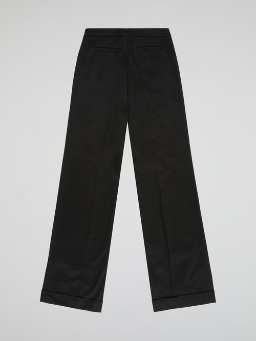 Step up your style game with these sleek and sophisticated Black Straight Leg Trousers by Blumarine. Crafted from premium quality fabric, these trousers are designed to flatter your figure and provide all-day comfort. Perfect for work or a night out, these versatile trousers will have you looking effortlessly chic and stylish.