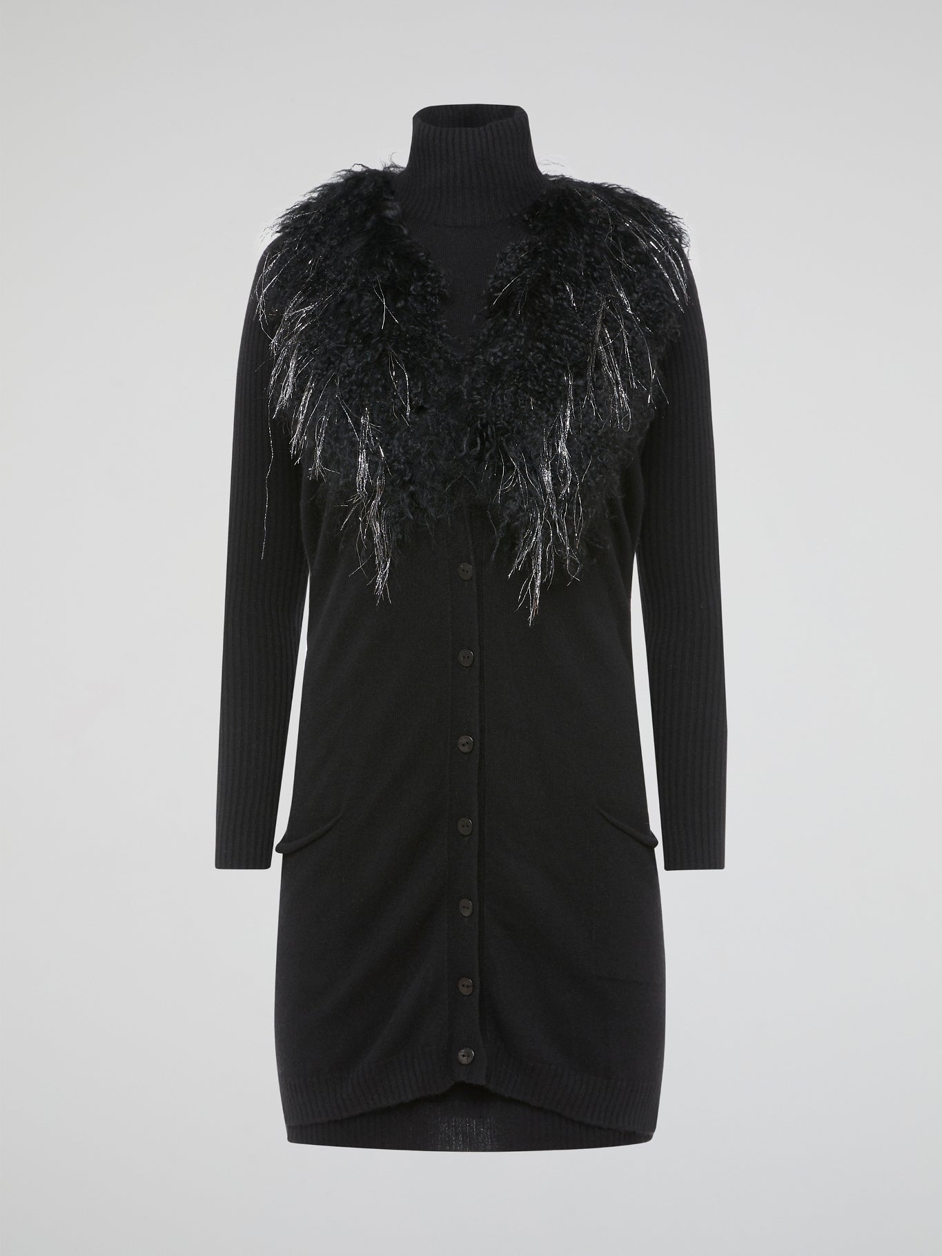 Step out in style and turn heads in our luxurious Black Faux Fur Sweater Dress by Blumarine. This fierce and fabulous dress features a soft faux fur exterior that will make you feel like a true fashionista. Whether you're hitting the town or cozying up at home, this dress is sure to make a statement and keep you warm all season long.