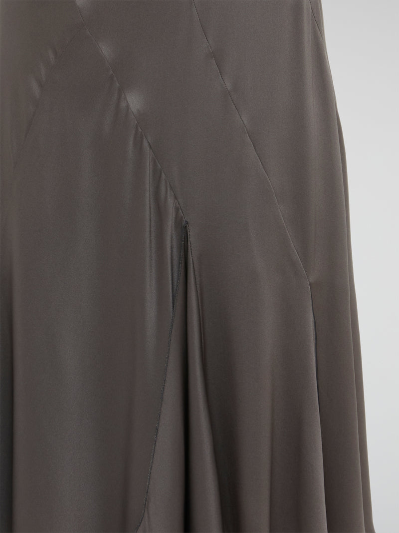 Indulge in effortless sophistication with our alluring Taupe Godet Midi Skirt from Blumarine. Crafted with exquisite detail and a mesmerizing godet design, this skirt is perfect for adding a touch of elegance to any outfit. Elevate your style and turn heads wherever you go with this luxurious and unique piece.