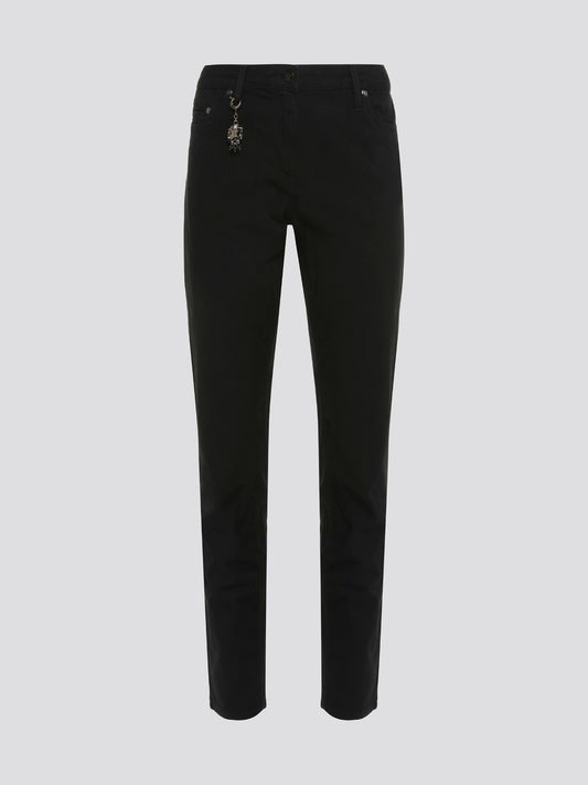 Step out in style with these sleek and versatile Black Skinny Fit Jeans from Roberto Cavalli. Made from premium quality denim, these jeans hug your curves in all the right places while offering unbeatable comfort. Whether dressed up with heels or down with sneakers, these jeans are a must-have for any fashion-forward wardrobe.