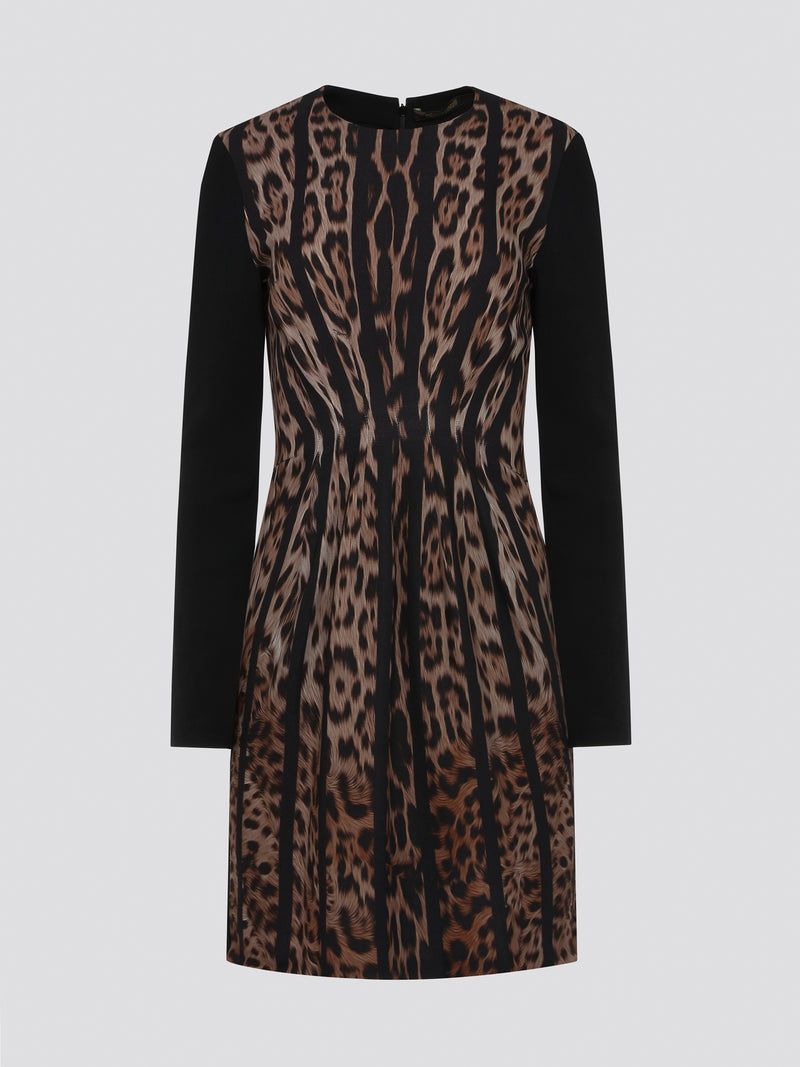 Step into the wild side with our Roberto Cavalli Leopard Print Long Sleeve Dress! This stunning statement piece features a fierce leopard print design that is sure to turn heads wherever you go. Made with high-quality materials, this dress embodies luxury and sophistication, making it the perfect choice for any stylish fashionista. Dress to impress and unleash your inner feline with this captivating Leopard Print Long Sleeve Dress from Roberto Cavalli.