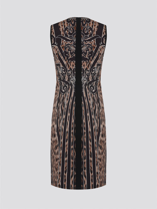 Fade into the wild with the Roberto Cavalli Leopard Print Sheath Dress. This fierce and fabulous statement piece will turn heads wherever you go, exuding confidence and sophistication. Embrace your inner predator and unleash your stylish prowess with this bold and daring dress.