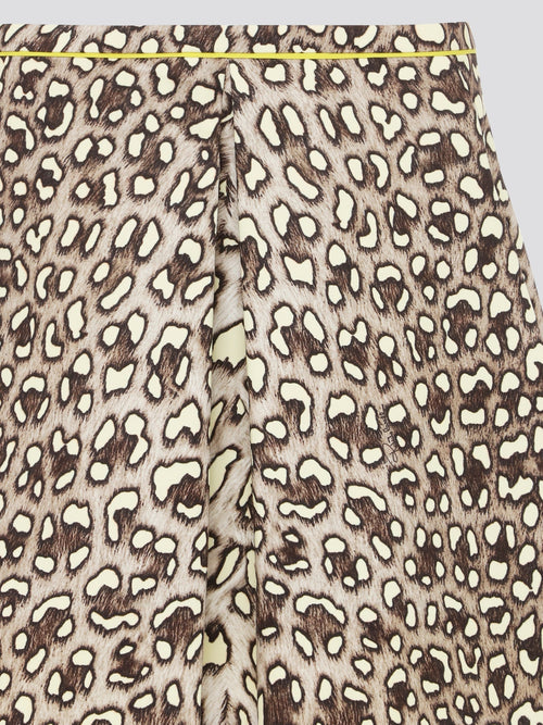 Unleash your wild side with the Leopard Print Box Pleat Mini Skirt from Roberto Cavalli. This fierce and flirty skirt features a bold leopard print pattern that is sure to turn heads wherever you go. With its flattering box pleats and mini length, this skirt is perfect for a night out on the town or a stylish day at the office.