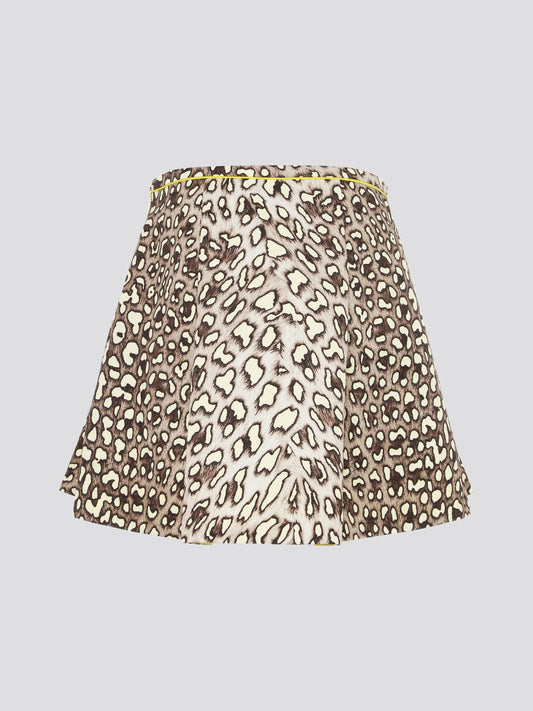 Unleash your wild side with the Leopard Print Box Pleat Mini Skirt from Roberto Cavalli. This fierce and flirty skirt features a bold leopard print pattern that is sure to turn heads wherever you go. With its flattering box pleats and mini length, this skirt is perfect for a night out on the town or a stylish day at the office.