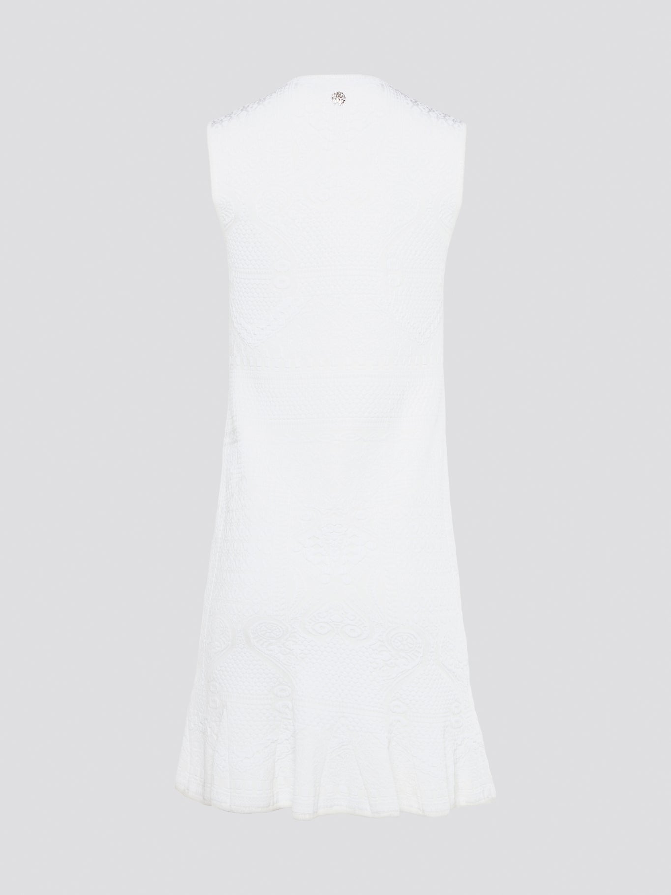 Feel effortlessly chic and sophisticated in this stunning White Sleeveless Mini Dress by Roberto Cavalli. The epitome of Italian luxury, the dress features a flattering silhouette and intricate detailing that is sure to turn heads. Perfect for any occasion, whether it's a summer soirée or a glamorous night out, this dress is a must-have for any fashion-forward woman.