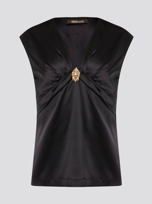 Make a bold statement with the Black Embellished Top by Roberto Cavalli, guaranteed to turn heads wherever you go. With intricate detailing and luxurious fabrics, this top is the epitome of high-end fashion. Elevate your wardrobe and stand out from the crowd with this stunning piece from one of the world's most renowned designers.