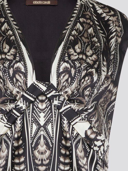Elevate your summer wardrobe with this effortlessly chic Black Printed Sleeveless Top from Roberto Cavalli. Crafted from luxurious materials, this top features a striking print that is sure to turn heads wherever you go. Pair it with tailored pants for a sophisticated office look, or dress it down with jeans for a casual weekend ensemble.