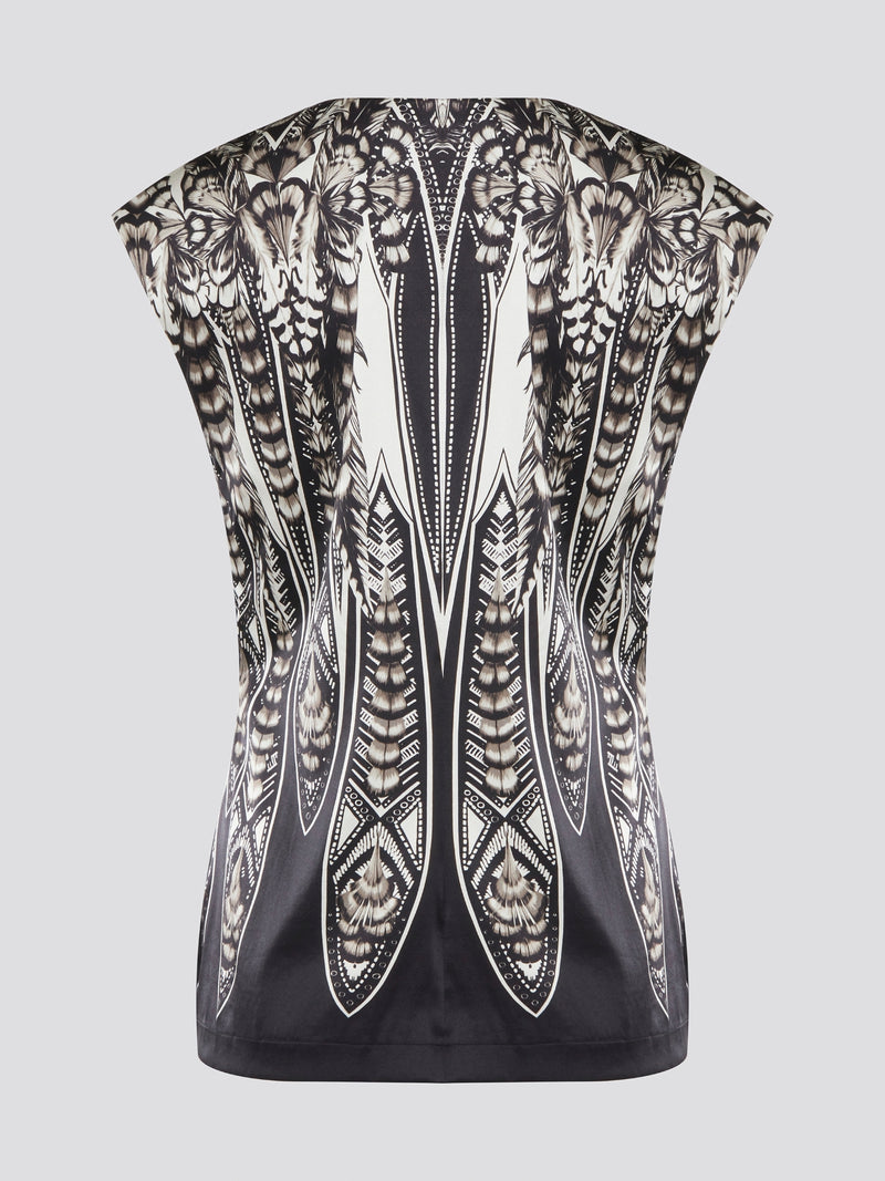 Elevate your summer wardrobe with this effortlessly chic Black Printed Sleeveless Top from Roberto Cavalli. Crafted from luxurious materials, this top features a striking print that is sure to turn heads wherever you go. Pair it with tailored pants for a sophisticated office look, or dress it down with jeans for a casual weekend ensemble.