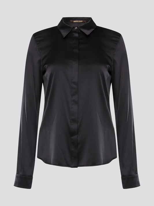 Step out in sleek and sophisticated style with this black satin shirt from Roberto Cavalli, a luxurious addition to your wardrobe. The silky smooth fabric drapes effortlessly, while the tailored fit adds a touch of elegance to any outfit. Perfect for a night out on the town or a special event, this shirt is sure to turn heads and make a statement.