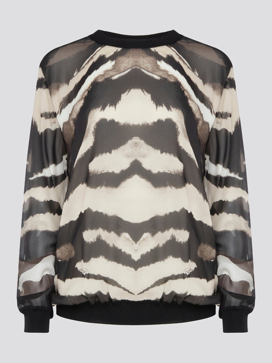Make a fierce fashion statement with the Roberto Cavalli Zebra Print Sweatshirt, featuring a bold and eye-catching zebra print design. Crafted from premium materials, this sweatshirt offers both style and comfort for all-day wear. Elevate your street style with this standout piece that is sure to turn heads wherever you go.