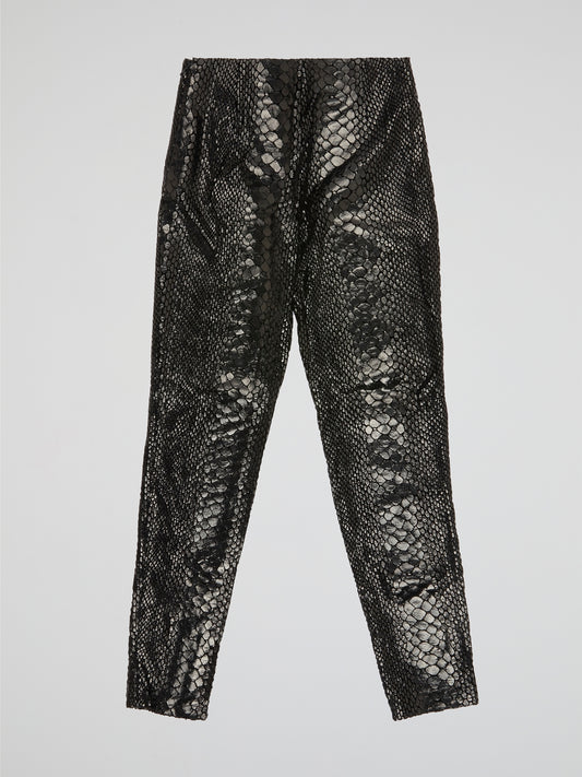 Unleash your wild side with our Black Reptilian Leather PantsIceberg, designed to make a bold statement. Crafted from high-quality faux leather with a sleek reptile texture, these pants are perfect for standing out in a crowd. Embrace your inner rockstar and take your style to the next level with these edgy and stylish pants.