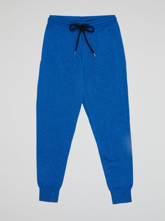 Elevate your casual style with these effortlessly chic Blue Drawstring Cuffed Pants by Markus Lupfer. Made from premium materials, these pants feature a flattering drawstring waist and trendy cuffed ankles for a modern twist on a classic silhouette. Perfect for a day out or a cozy night in, these versatile pants will quickly become a wardrobe staple.